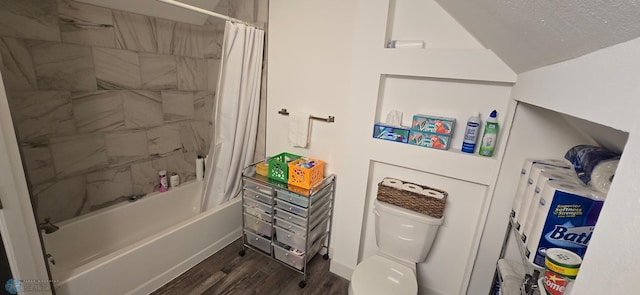 304 1st Ave E, Halstad, MN 56548 - bathroom with wood finished floors, shower / tub combo, toilet, and lofted ceiling