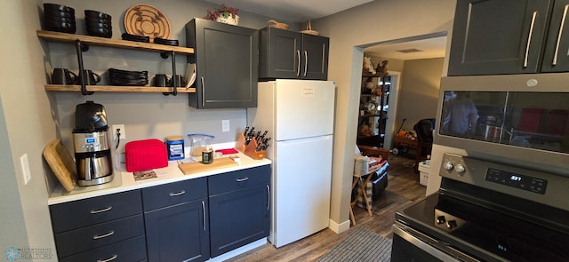 304 1st Ave E, Halstad, MN 56548 - kitchen with stainless steel appliances, wood finished floors, light countertops, and open shelves