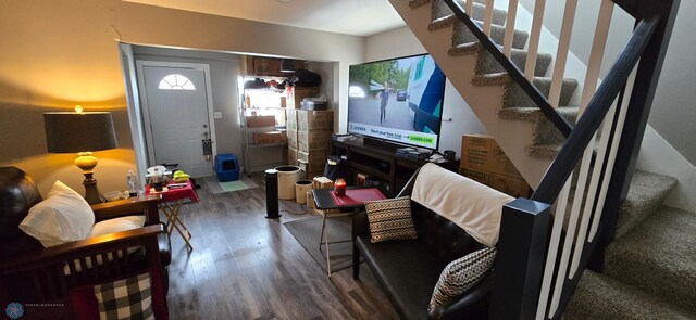 304 1st Ave E, Halstad, MN 56548 - living area featuring wood finished floors, stairway, and healthy amount of natural light