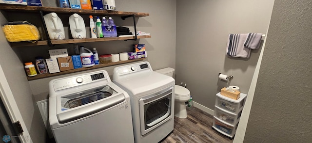 304 1st Ave E, Halstad, MN 56548 - washroom featuring washing machine and dryer and wood finished floors