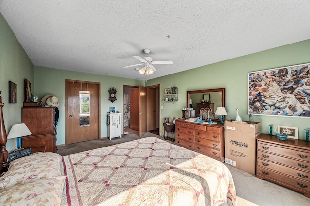 2231 Penn Pl Unit 114, North Saint Paul, MN 55109 - bedroom featuring carpet floors, a textured ceiling, multiple closets, and a ceiling fan