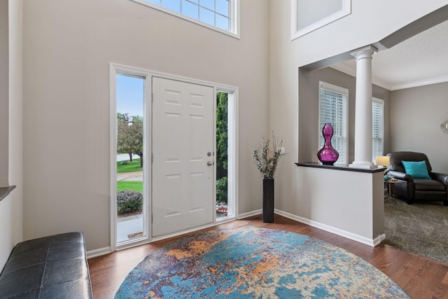 13148 Crolly Ct, Rosemount, MN 55068 - entrance foyer with decorative columns, wood finished floors, baseboards, and ornamental molding