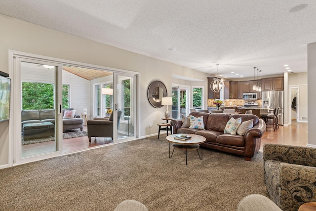 13148 Crolly Ct, Rosemount, MN 55068 - living room featuring healthy amount of natural light, baseboards, light carpet, a textured ceiling, and recessed lighting