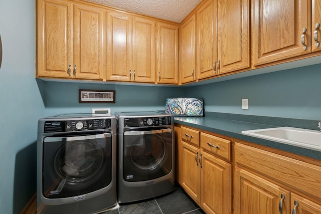 13148 Crolly Ct, Rosemount, MN 55068 - laundry room featuring washing machine and dryer, cabinet space, and dark tile patterned flooring