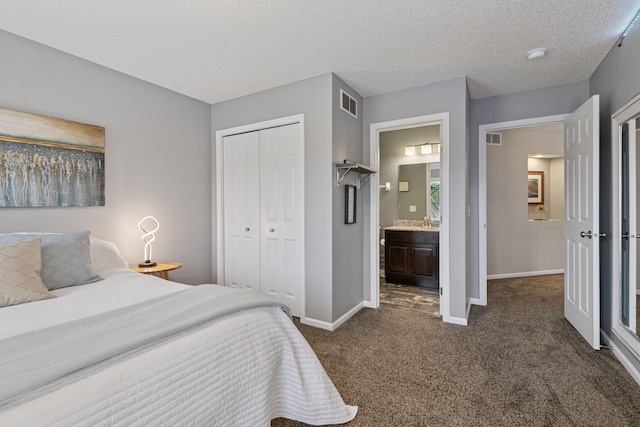 13148 Crolly Ct, Rosemount, MN 55068 - bedroom with dark carpet, baseboards, a closet, ensuite bathroom, and a textured ceiling