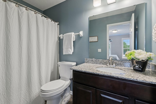 13148 Crolly Ct, Rosemount, MN 55068 - full bathroom with a textured ceiling, vanity, toilet, and a shower with shower curtain