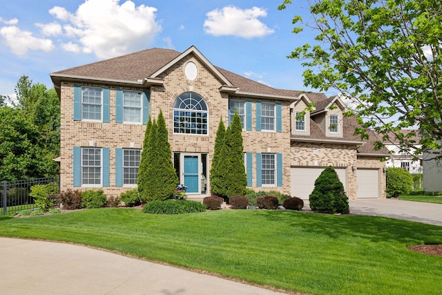 13148 Crolly Ct, Rosemount, MN 55068 - colonial home with driveway, brick siding, roof with shingles, and an attached garage