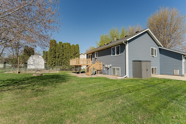rear view of house featuring a deck and stairs