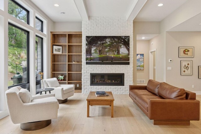 16798 Stirrup Ln, Eden Prairie, MN 55347 - living room with a fireplace, wood finished floors, beamed ceiling, and recessed lighting