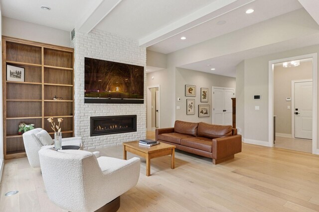 16798 Stirrup Ln, Eden Prairie, MN 55347 - living room featuring a brick fireplace, beam ceiling, wood finished floors, baseboards, and recessed lighting