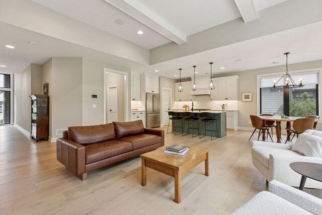 16798 Stirrup Ln, Eden Prairie, MN 55347 - living room with a chandelier, light wood-type flooring, beam ceiling, recessed lighting, and baseboards