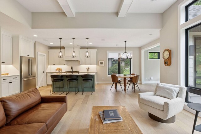 16798 Stirrup Ln, Eden Prairie, MN 55347 - living room with beamed ceiling, light wood finished floors, baseboards, recessed lighting, and a chandelier