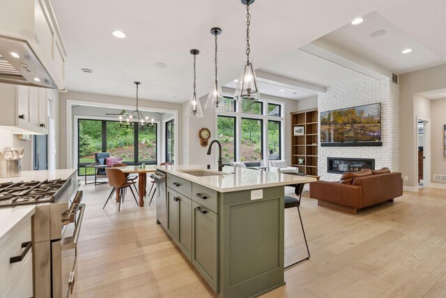 16798 Stirrup Ln, Eden Prairie, MN 55347 - kitchen featuring a sink, appliances with stainless steel finishes, light countertops, healthy amount of natural light, and recessed lighting