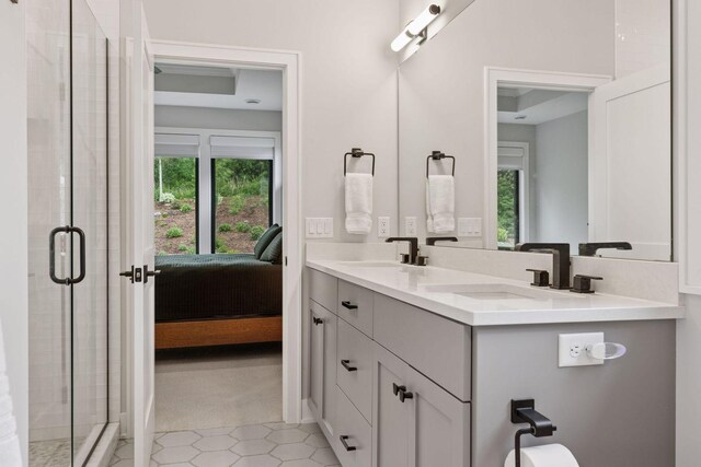16798 Stirrup Ln, Eden Prairie, MN 55347 - ensuite bathroom with a shower stall and double vanity