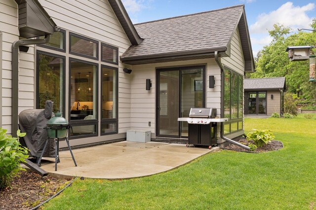 16798 Stirrup Ln, Eden Prairie, MN 55347 - back of house with a patio, a shingled roof, and a yard