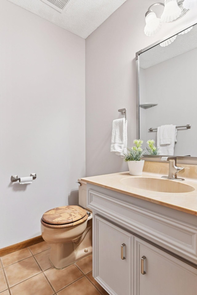 7010 Tartan Curv, Eden Prairie, MN 55346 - half bathroom with vanity, tile patterned flooring, and a textured ceiling