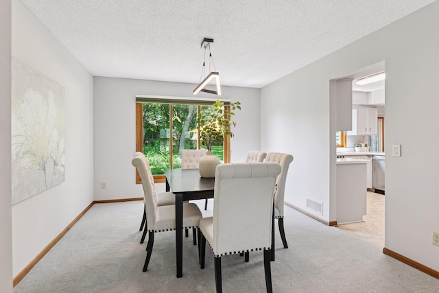 7010 Tartan Curv, Eden Prairie, MN 55346 - dining room featuring light colored carpet and a textured ceiling