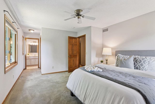 7010 Tartan Curv, Eden Prairie, MN 55346 - bedroom with carpet flooring, ensuite bath, ceiling fan, and a textured ceiling