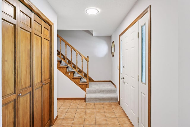 7010 Tartan Curv, Eden Prairie, MN 55346 - foyer entrance with stairway, light tile patterned floors, and light carpet