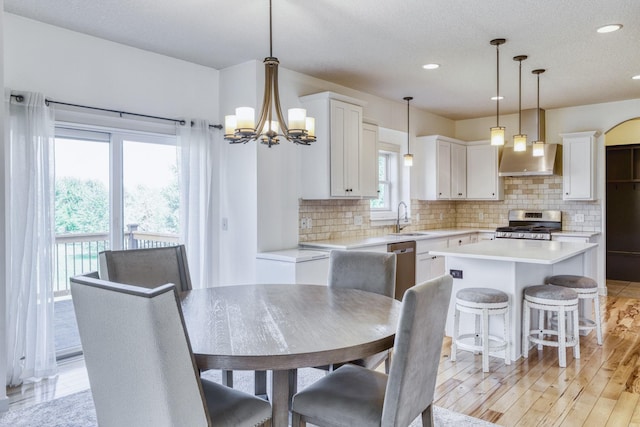 1730 Deephaven Dr, Woodbury, MN 55129 - dining space featuring recessed lighting, a chandelier, and light wood-type flooring