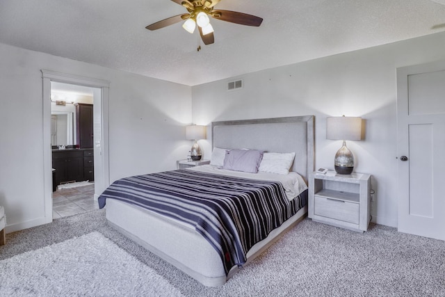 1730 Deephaven Dr, Woodbury, MN 55129 - carpeted bedroom featuring a textured ceiling, ceiling fan, ensuite bath, and baseboards