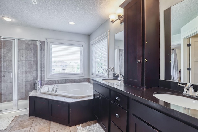 1730 Deephaven Dr, Woodbury, MN 55129 - bathroom featuring a textured ceiling, a shower stall, a bath, double vanity, and tile patterned floors