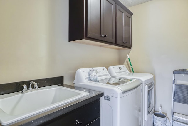 1730 Deephaven Dr, Woodbury, MN 55129 - washroom with cabinet space, washer and clothes dryer, and a textured ceiling