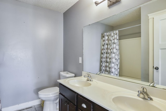 1730 Deephaven Dr, Woodbury, MN 55129 - full bathroom featuring a textured ceiling, toilet, tile patterned flooring, a shower with curtain, and double vanity
