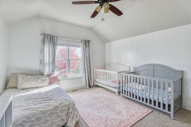 1730 Deephaven Dr, Woodbury, MN 55129 - bedroom with lofted ceiling, carpet flooring, a textured ceiling, ceiling fan, and baseboards