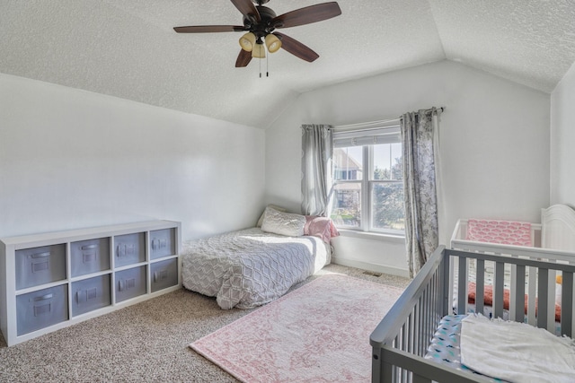 1730 Deephaven Dr, Woodbury, MN 55129 - bedroom featuring vaulted ceiling, a textured ceiling, carpet, and a ceiling fan