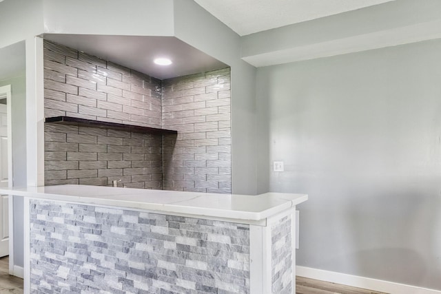 1730 Deephaven Dr, Woodbury, MN 55129 - detailed view of a bar, baseboards, and wood finished floors
