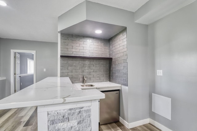 1730 Deephaven Dr, Woodbury, MN 55129 - indoor wet bar featuring light wood finished floors, fridge, and baseboards