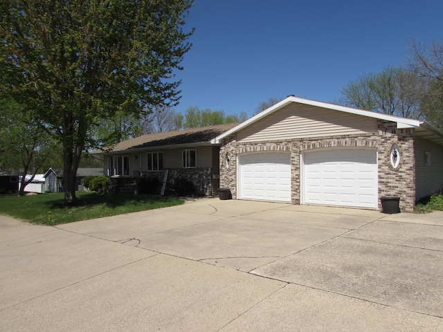 single story home with an attached garage, driveway, and brick siding