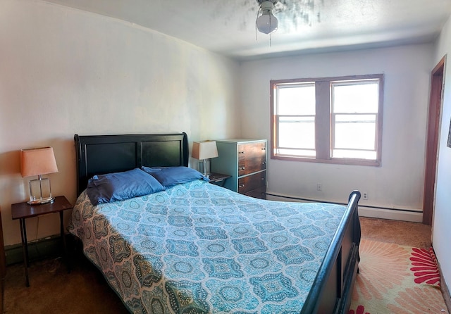 bedroom with carpet, a baseboard radiator, baseboards, and a ceiling fan