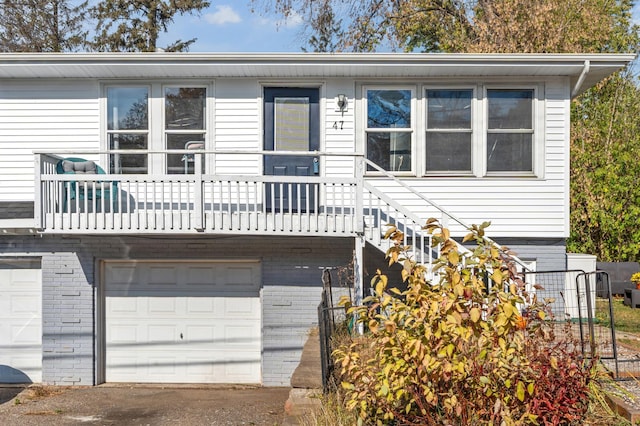 view of front of property with an attached garage and brick siding