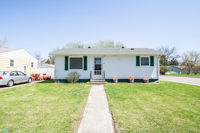 view of front of house featuring a front lawn and entry steps