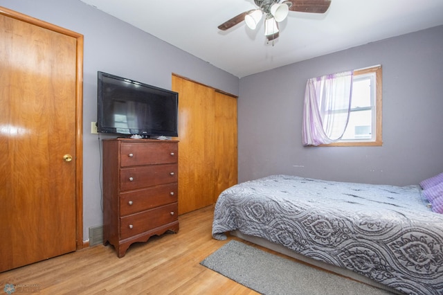 bedroom with wood finished floors and ceiling fan