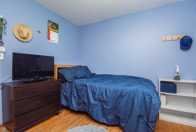 bedroom with wood finished floors