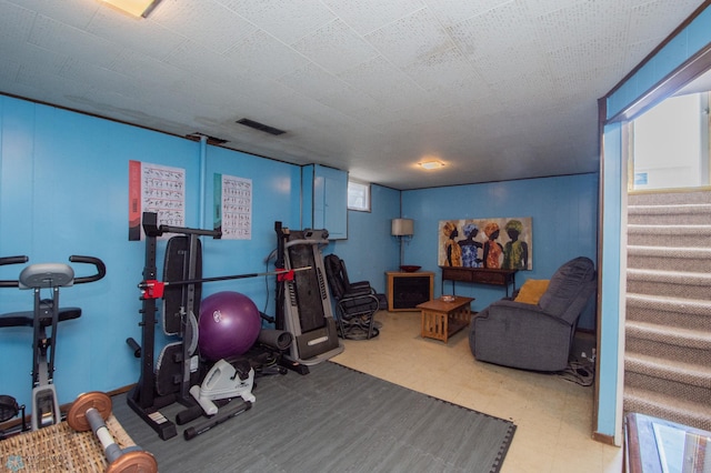 exercise room featuring tile patterned floors