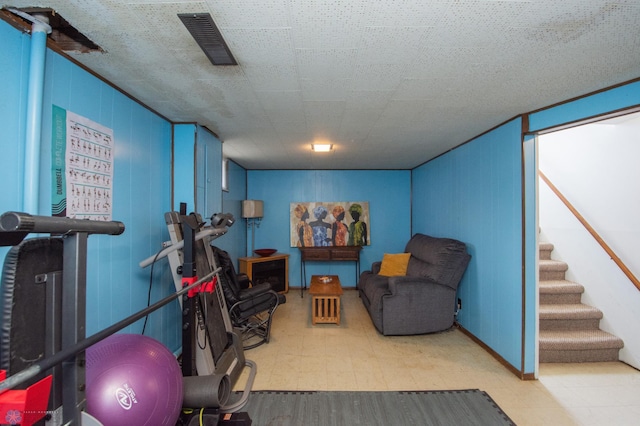 workout area with tile patterned floors