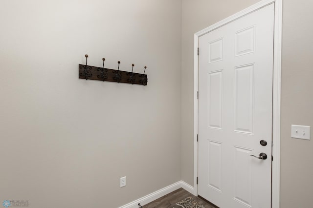 3313 5th Way E Unit B, West Fargo, ND 58078 - doorway to outside featuring baseboards and dark wood-style flooring