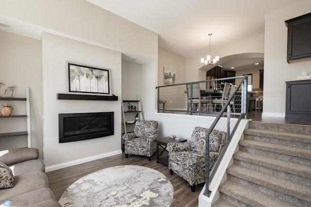 3313 5th Way E Unit B, West Fargo, ND 58078 - living room with a glass covered fireplace, stairway, wood finished floors, and baseboards