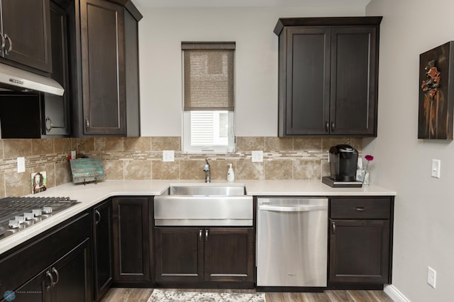 3313 5th Way E Unit B, West Fargo, ND 58078 - kitchen featuring stainless steel appliances, a sink, backsplash, light countertops, and light wood finished floors