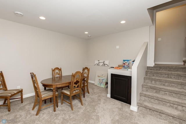 3313 5th Way E Unit B, West Fargo, ND 58078 - dining area with light carpet, stairway, baseboards, and recessed lighting