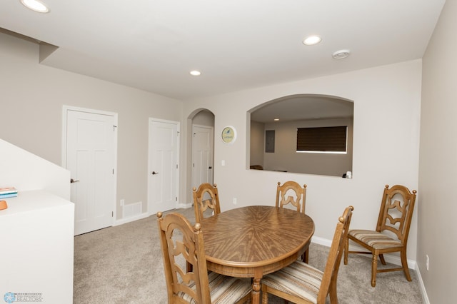 3313 5th Way E Unit B, West Fargo, ND 58078 - dining space featuring light carpet, recessed lighting, baseboards, and arched walkways