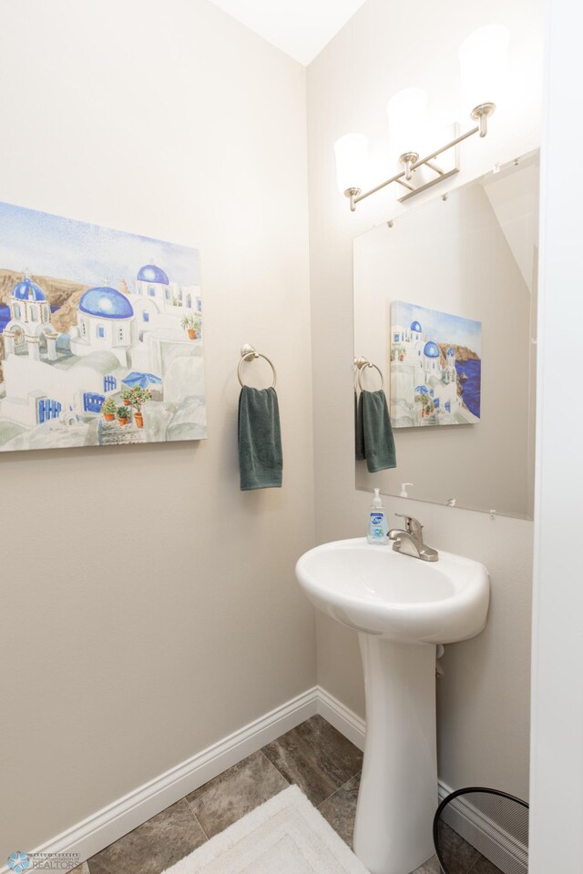 3313 5th Way E Unit B, West Fargo, ND 58078 - bathroom with baseboards and a chandelier