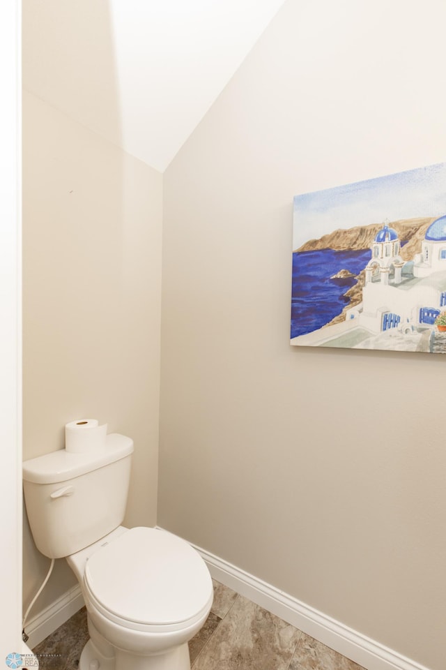 3313 5th Way E Unit B, West Fargo, ND 58078 - bathroom featuring baseboards and toilet