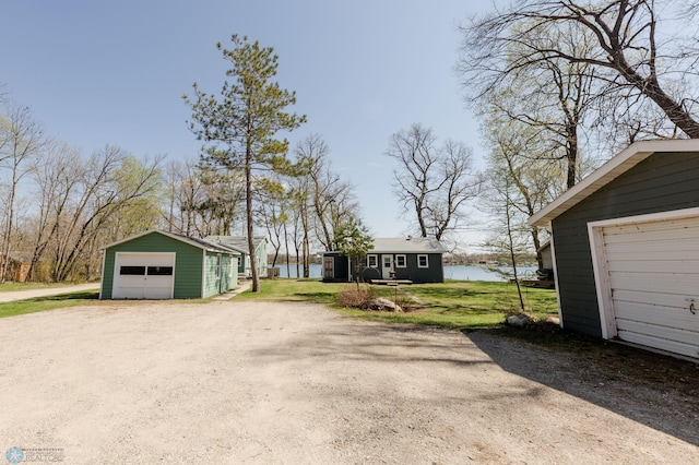 20841AND20850 Leona Beach Rd, Erie Twp, MN 56578 - detached garage featuring dirt driveway and a water view