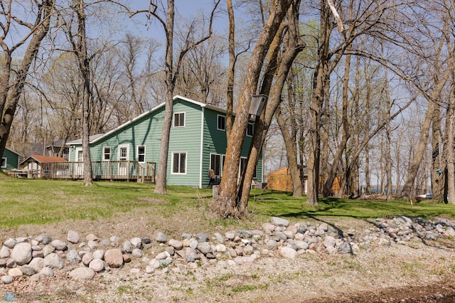 20841AND20850 Leona Beach Rd, Erie Twp, MN 56578 - view of home's exterior with a deck and a lawn