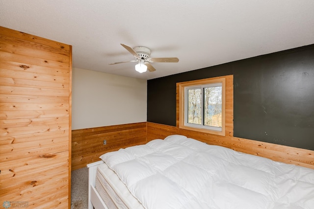 20841AND20850 Leona Beach Rd, Erie Twp, MN 56578 - carpeted bedroom with ceiling fan and wood walls